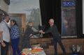 OAS_40th_Anniversary_Event_16-10-20212C_Elaine_being_presented_with_bouquet_by_Andrew.JPG